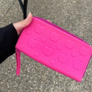 Bright pink water proof wallet. Doesn’t have any pockets.